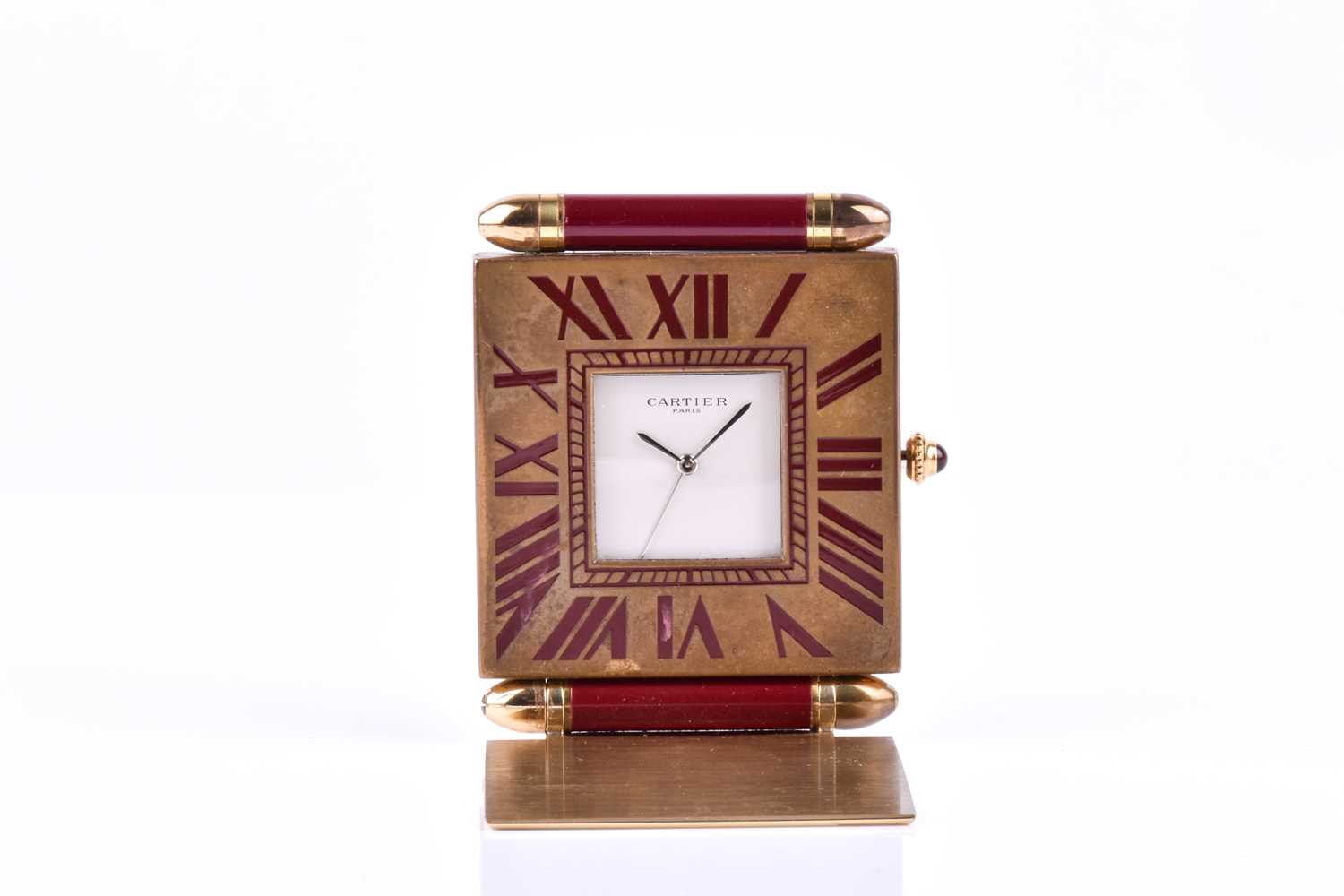 A Cartier travel clock, of square form with gilt metal case with claret lacquered Roman numerals, - Image 11 of 13