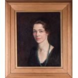 Flora Lion (1876-1958) British, a head and shoulders portrait of a lady, her hair tied up and