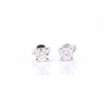 A pair of solitaire diamond ear studs, the diamonds of approximately 0.90 carats combined, four-claw