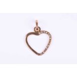A yellow metal heart-shaped pendant, inset with small white stones (some lacking), 2cm wide,