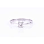A platinum and diamond ring, set with a princess-cut diamond of approximately 0.24 carats, SI2-1