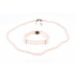 A cultured pearl necklace, the graduated pearls measuring from 4 - 9 mm, fastened with a 9ct