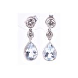 A pair of 18ct white gold, diamond, and aquamarine drop earrings, each with two collet-set