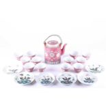 A ten thousand blessing teapot and nine tea bowls, 20th century, each with Wan Shou Wu Jiang