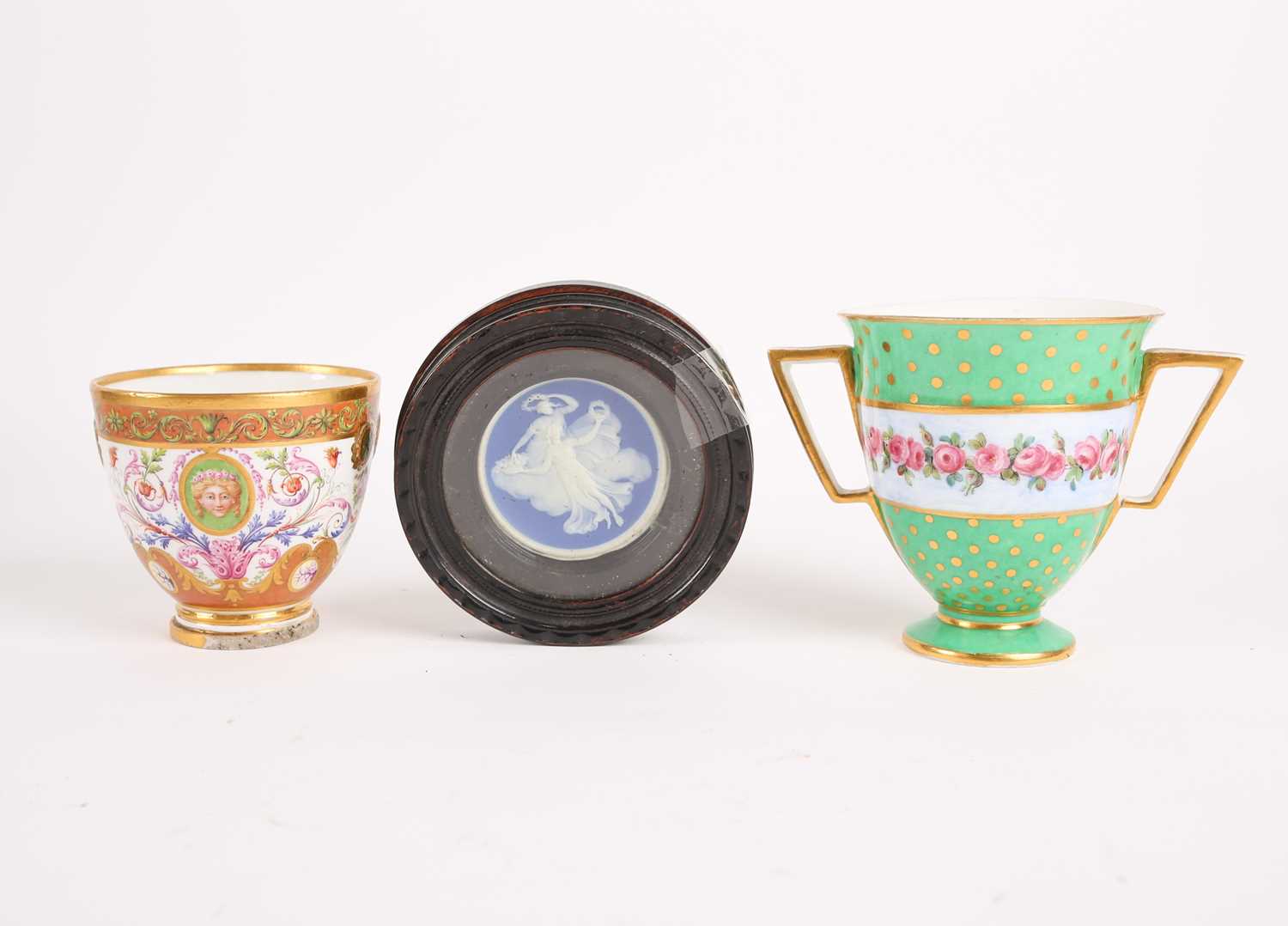 A late 18th century Serves two handled cup, with a raised central band decorated with roses and