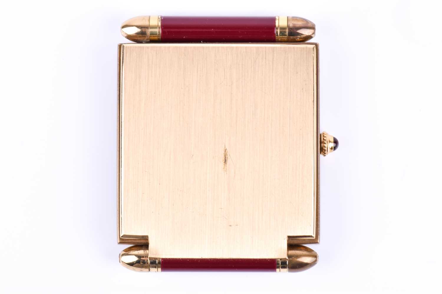 A Cartier travel clock, of square form with gilt metal case with claret lacquered Roman numerals, - Image 13 of 13