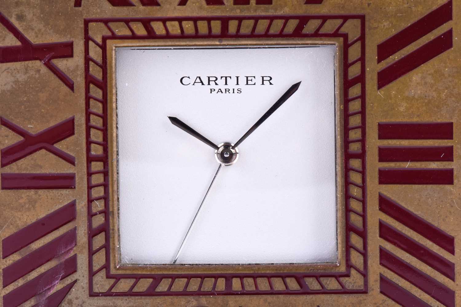 A Cartier travel clock, of square form with gilt metal case with claret lacquered Roman numerals, - Image 8 of 13