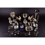 A mixed group of silver items to include an inkstand (lacking bottle), trumpet vase, cruets, a pin