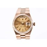 A Rolex Oysterquartz Day-Date 18ct gold wristwatch, the gilt dial with baton indices, day date
