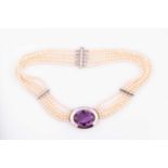 A silver, pearl, and amethyst necklacethe oval silver pendant inset with a large oval-cut