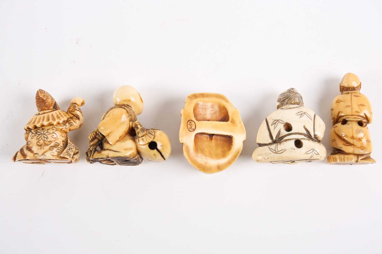 Five Japanese ivory netsukes, late 19th/early 20th century, to include a performer wearing a mask, a - Image 3 of 3