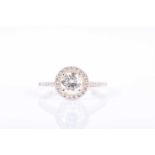 A 14ct yellow gold and diamond halo ringcentred with a round brilliant-cut diamond of 1.02 carats,