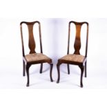 A pair of Queen Anne style dining chairs, with vase shaped back splats, drop in seats and cabriole