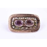 A 19th century gilt, amethyst, and pearl brooch, of rectangular form, centred with two mixed oval-