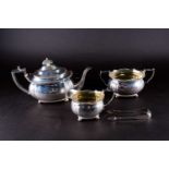 A matched Georgian silver tea set, London 1829 by Charles Fox (teapot) and 1818 by Solomon