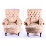 A pair of large button back armchairs in the manner of George Smith, each upholstered in floral