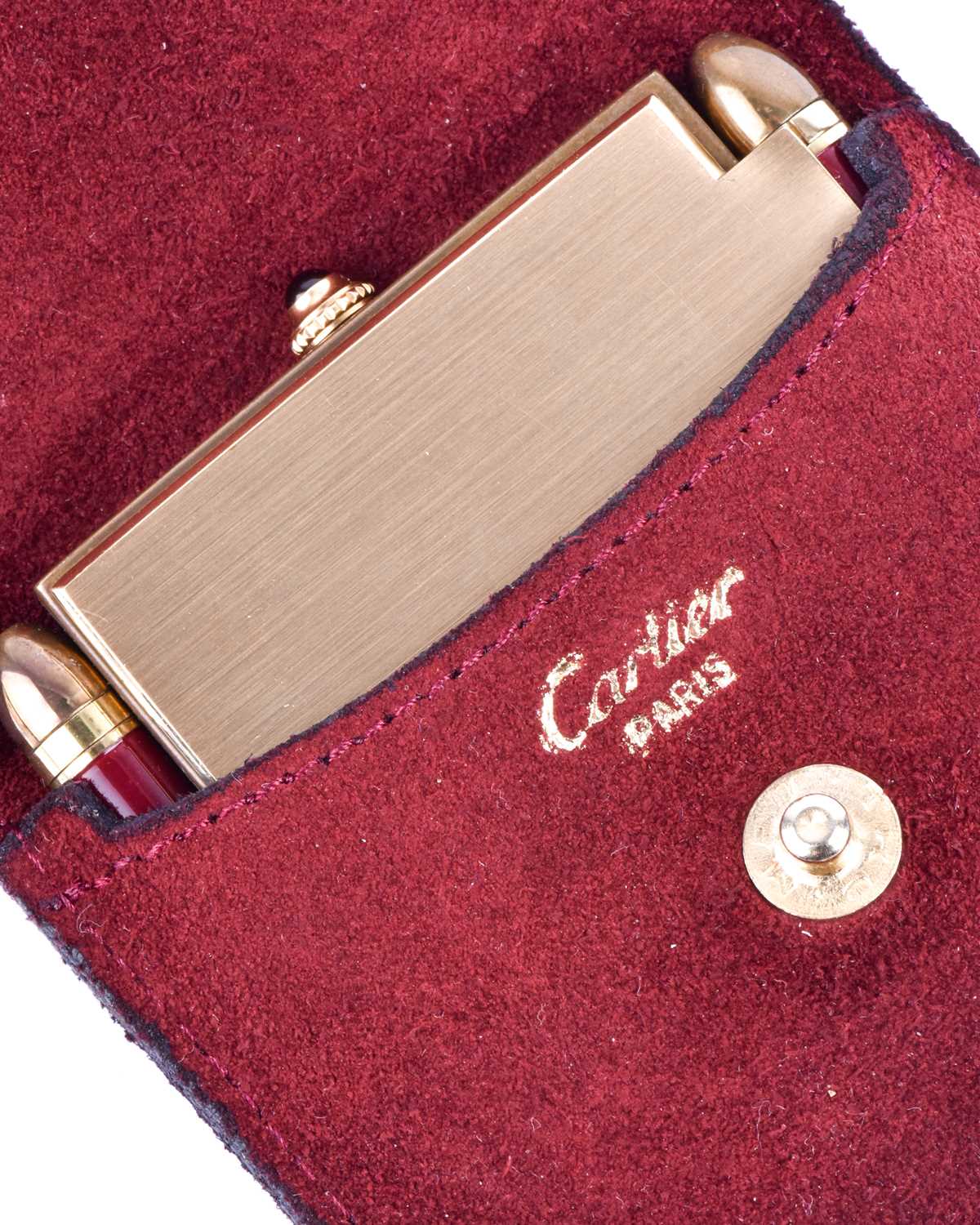 A Cartier travel clock, of square form with gilt metal case with claret lacquered Roman numerals, - Image 7 of 13