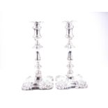 A pair of Edwardian silver candlesticks, Birmingham 1909 by Ellis & Co, with moulded acanthus