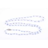 An opera length moonstone and sapphire necklace, formed of graduated rounded moonstones,
