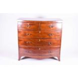 A Victorian mahogany bow-front chest of drawers, with two short and three long graduated drawers,