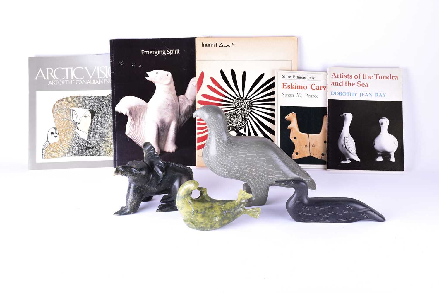 A collection of four 20th century carved inuit sculptures to include a Loon (by Moses Appaqaq), a