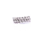 A white metal and diamond half eternity ring, set with two rows of marquise-cut diamonds of