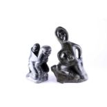 Two 20th century Alaska Inuit carved abstract figures, modelled as a mother with her child, finished