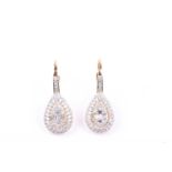 A pair of yellow gold and diamond drop earrings, pave set with round-cut and emerald-cut diamonds,