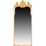 A Queen Anne gilt gesso pier mirror, the shell carved top with scrolled foliate and acanthus
