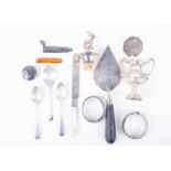 A mixed group of silver items to include a twin-handled miniature trophy, two bangles, flatware