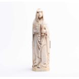 A 19th century Dieppe ivory carved triptych figure of a nun, her robes opening to reveal Classical