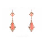 A pair of yellow metal and carved coral drop earrings, the removable lower drops set with pear-