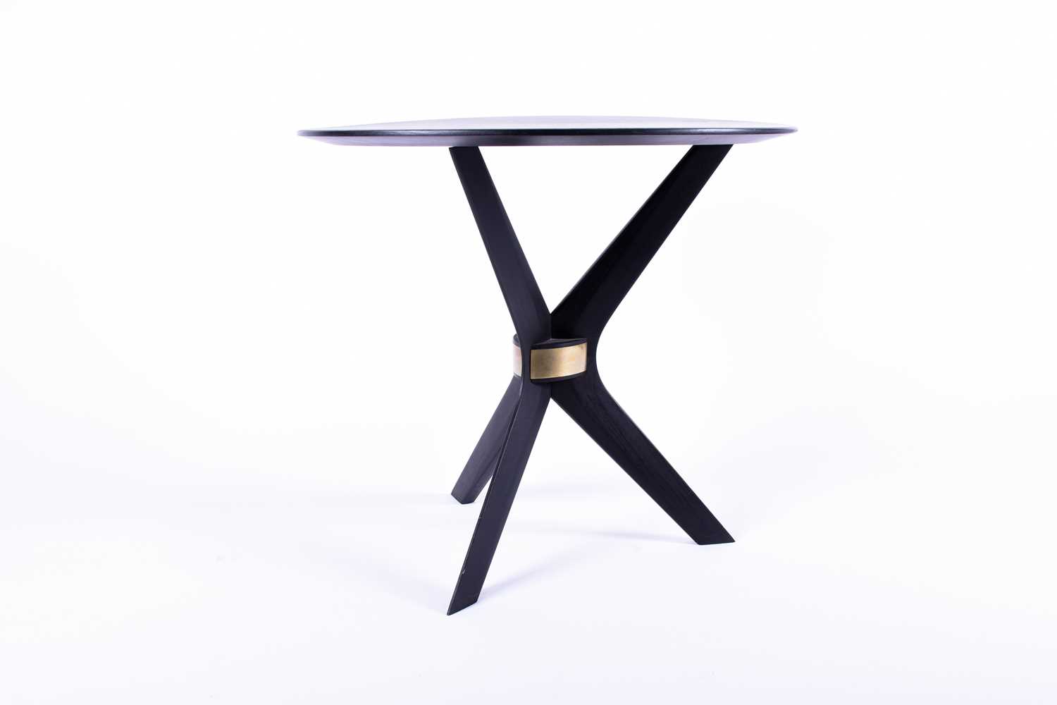 A Birgit Israel ebonised side table, the plain circular top supported on boomerang shaped legs, with - Image 2 of 3