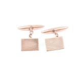 A pair of 9ct yellow gold cufflinks, with rectangular engine-turned plaques, and hollow lozenge