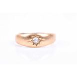 An 18ct yellow gold gents ring, bright-cut set with a round-cut diamond of approximately 0.20