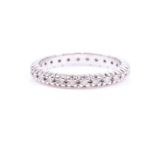 A diamond eternity ring, claw-set all around with round-cut diamonds of approximately 0.70 carats