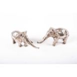 A pair of Japanese silvered bronze elephants, realistically modelled cast figures with