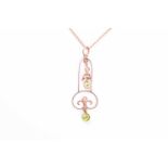 An Art Nouveau yellow gold and peridot pendant, the openwork elongated mount with suspended pearl