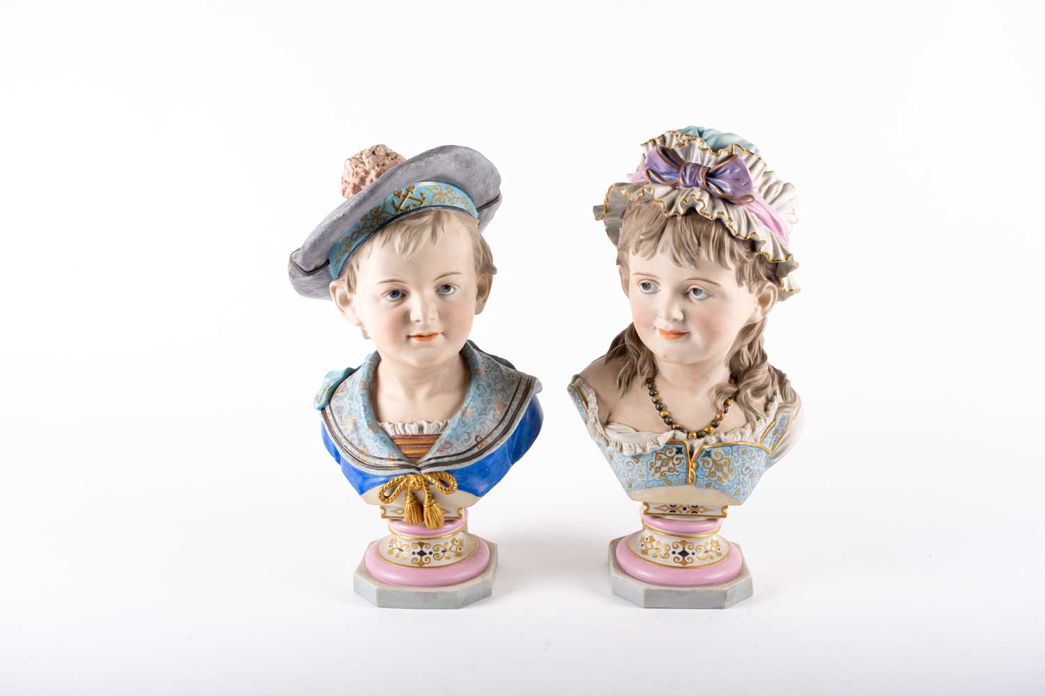 PAIR OF AWF KIRSTER, MOLLER GERMAN BISQUE PORCELAIN BUSTS, Designed by Reinhard Moller, painted in