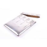 An early 20th century silver visiting card case, with bow and swag decoration to smooth case,