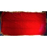 A large red velvet altar cloth with gold thread tassled border, early 20th century, 170 cm x 310
