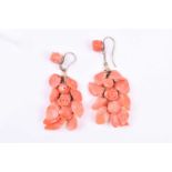 A pair of gilt metal and coral cluster drop earrings, formed of carved coral flowers and leaves, 5.2