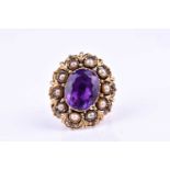 A yellow metal, amethyst, and pearl cocktail ring, set with a mixed oval-cut amethyst, in closed-