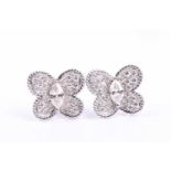 A pair of diamond earrings, of butterfly design, each set with a marquise-cut diamond and small