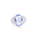An impressive Ceylon sapphire cocktail ring, set with a mixed oval cushion-cut sapphire of