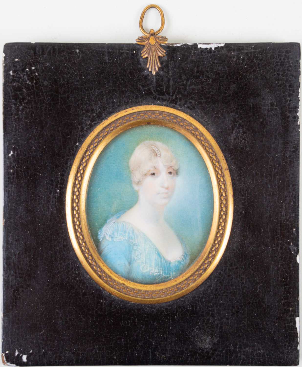 An 18th century oval portrait miniature on ivory, head and shoulders protrait of a lady, in an