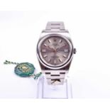 A rare Rolex Oyster Perpetual 'Domino's Pizza' ref. 116000 stainless steel automatic wristwatch, the