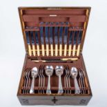 An early 20th century canteen of silver plated flatware, twelve place setting, contained in an oak