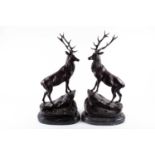 After Jules Moigniez, a pair of large bronze stags, each with twelve point antlers, modelled on a