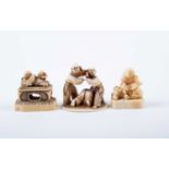 A Japanese ivory okimono and two netsukes, Meiji, the humorous okimono carved as three blind men